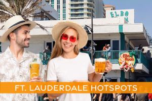 Man and woman holding adult beverages in front of Fort Lauderdale's famous Elbo Room bar.